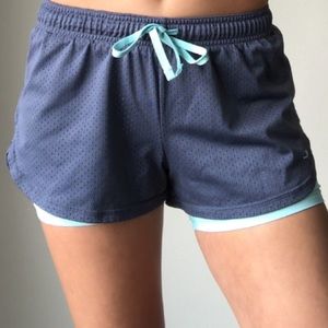 Grey athletic shorts with attached spandex